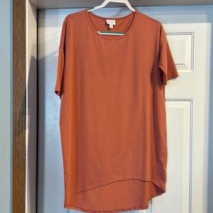 Lula Roe 95% polyester top, coral in color, size small.